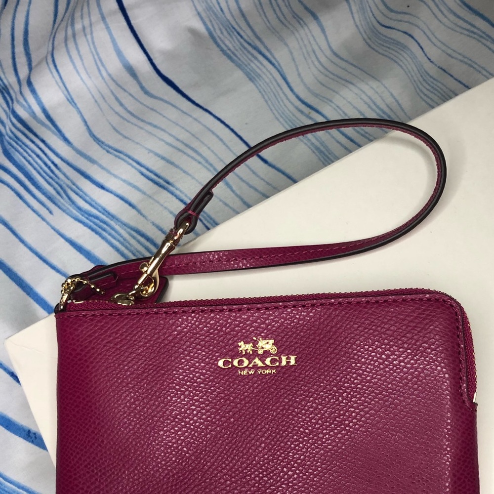 Plum Coach Wristlet